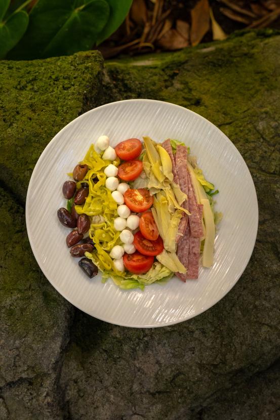 Antipasto salad on a white plate